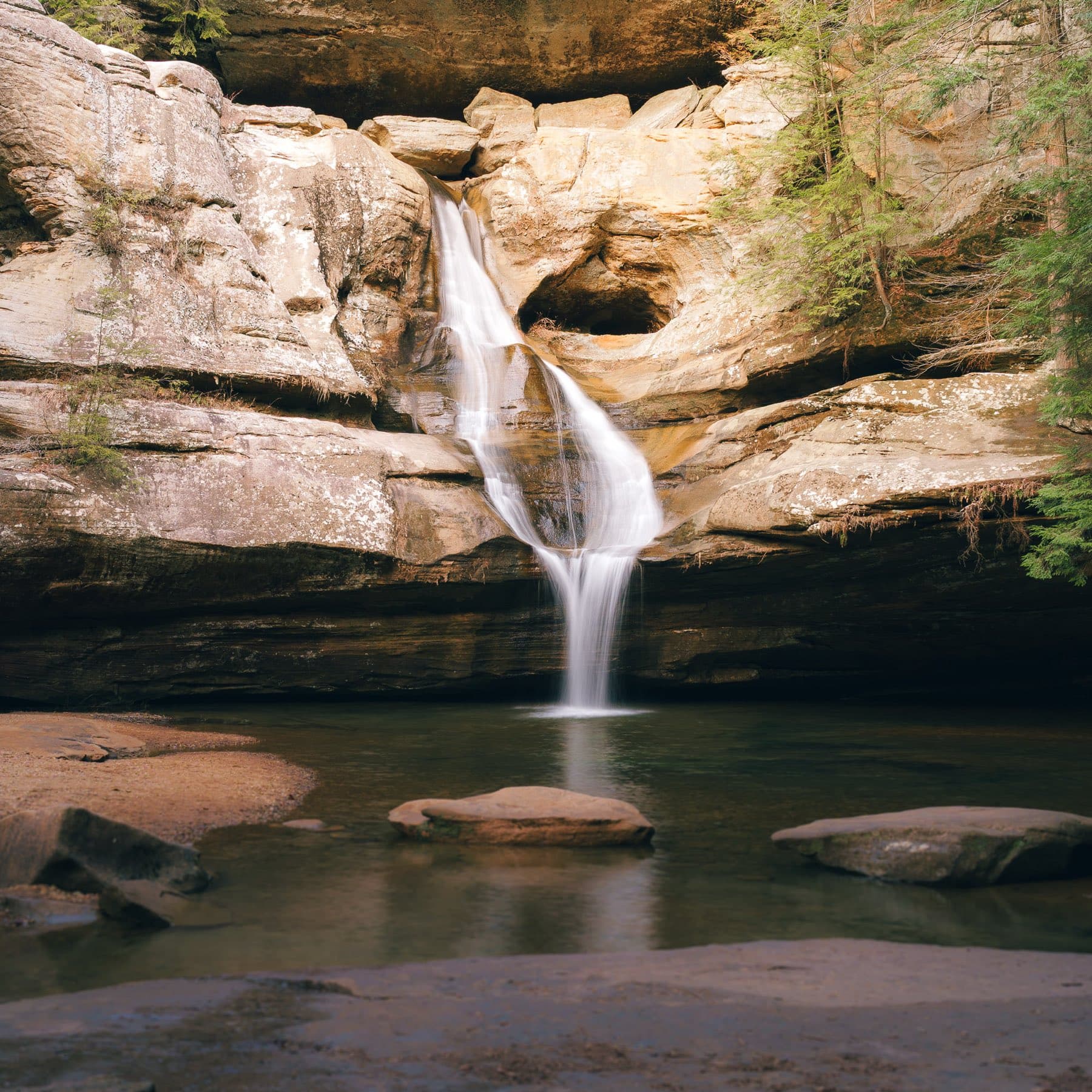 The waterfall spilling into the recess cave at Ash Cave in the Hocking Hills